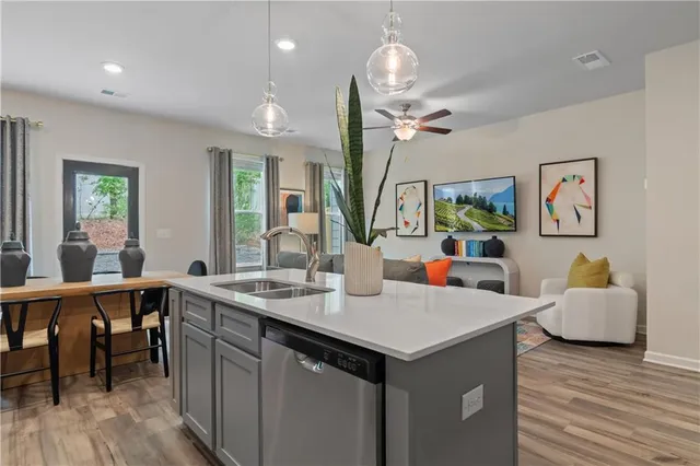 a view of living room filled with furniture and wooden floor