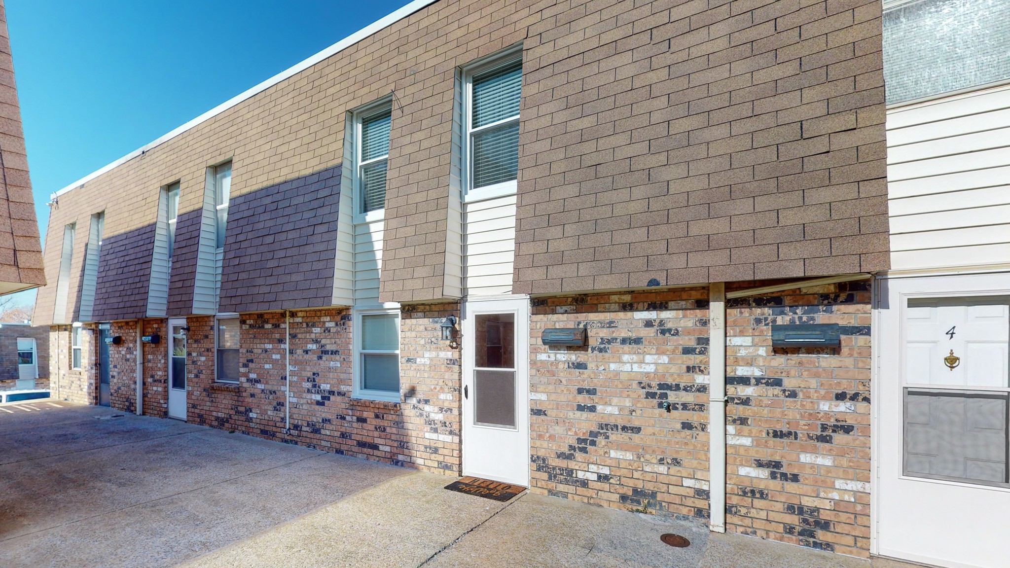 a brick building with a window and door