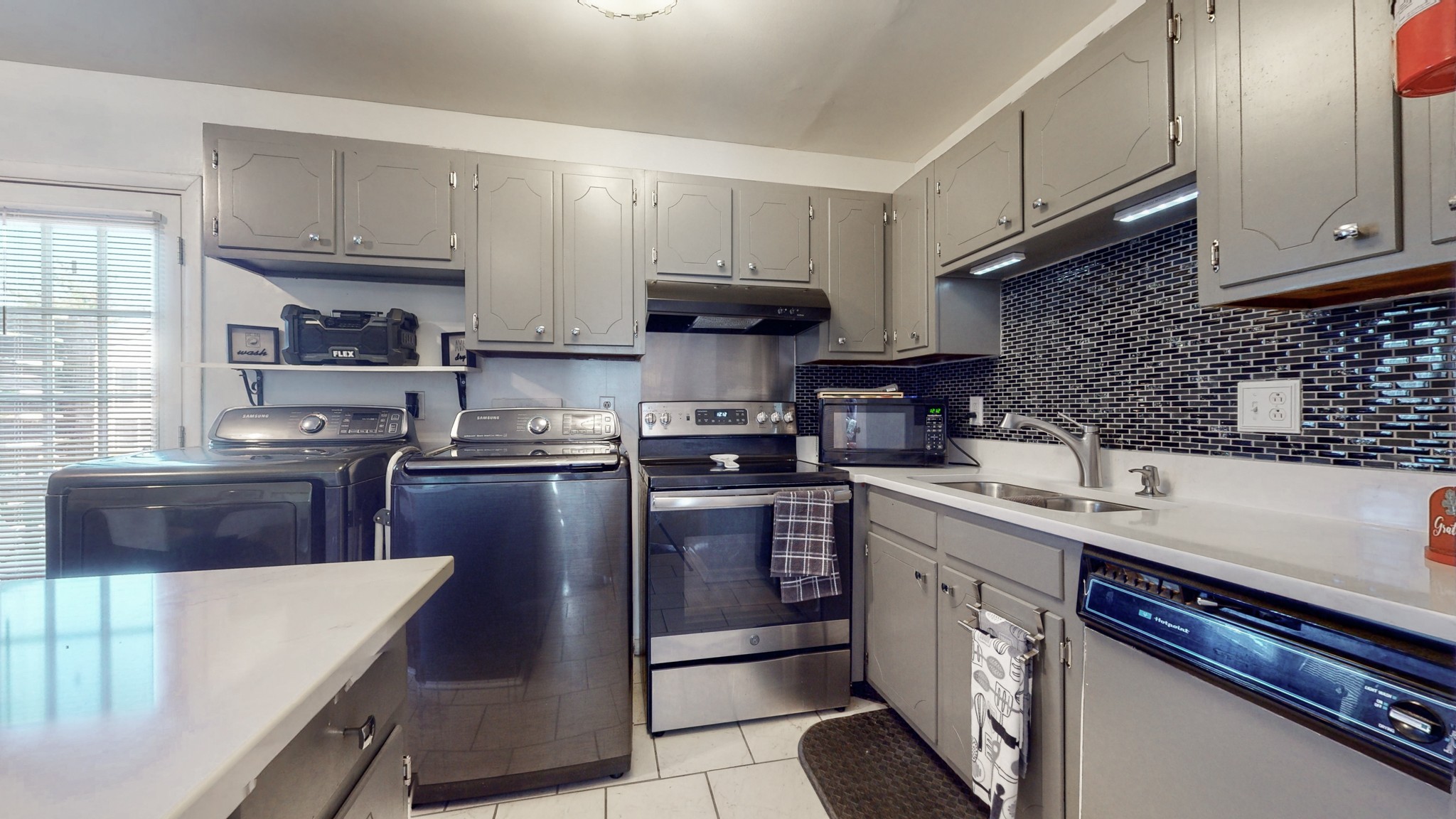 370 Wallace Road, Unit G3 Nashville, TN 37211 - Photo 13 of 30 a kitchen with stainless steel appliances granite countertop a sink stove and refrigerator
