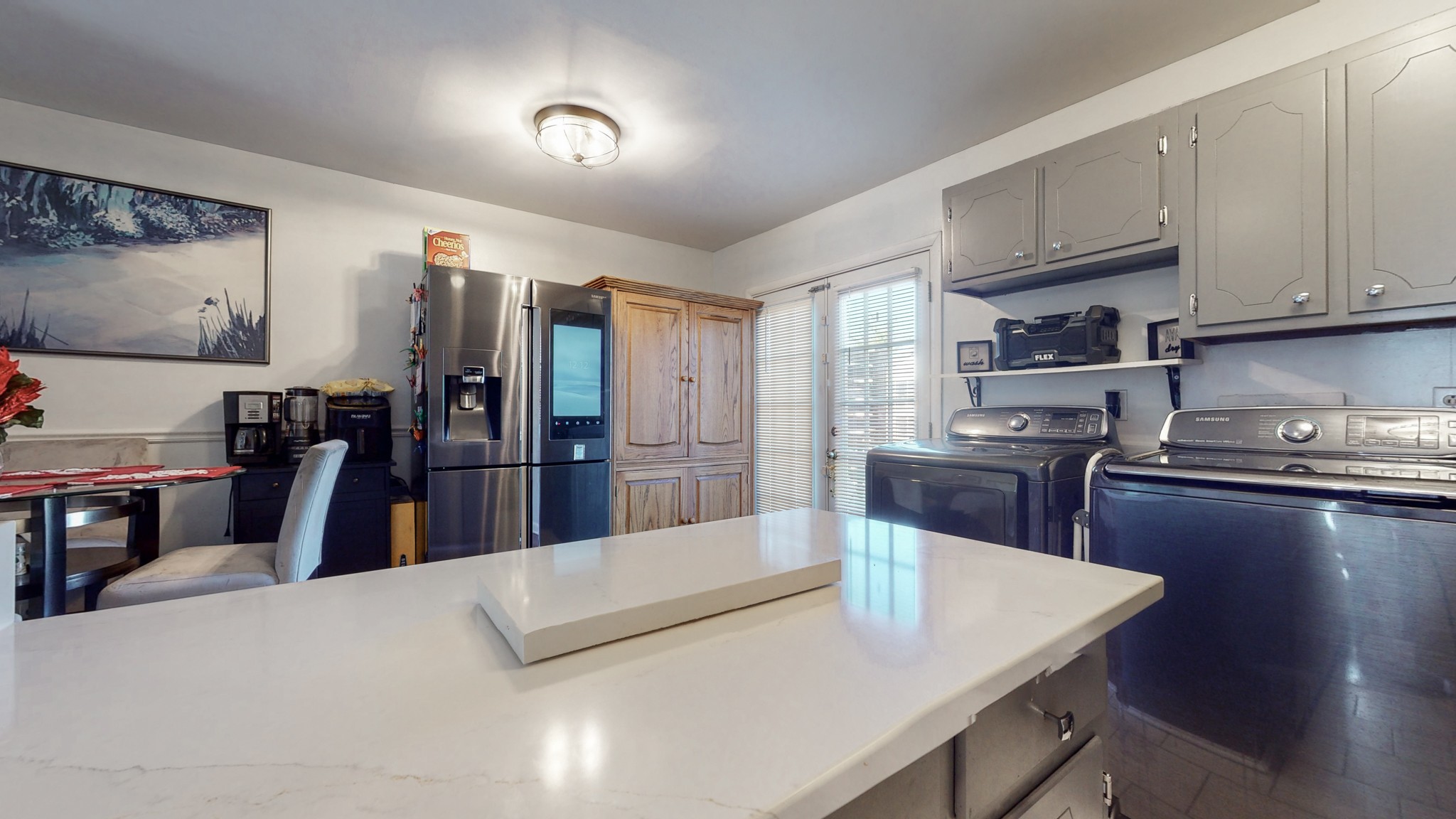 370 Wallace Road, Unit G3 Nashville, TN 37211 - Photo 14 of 30 a kitchen with stainless steel appliances kitchen island granite countertop a sink dishwasher stove and refrigerator