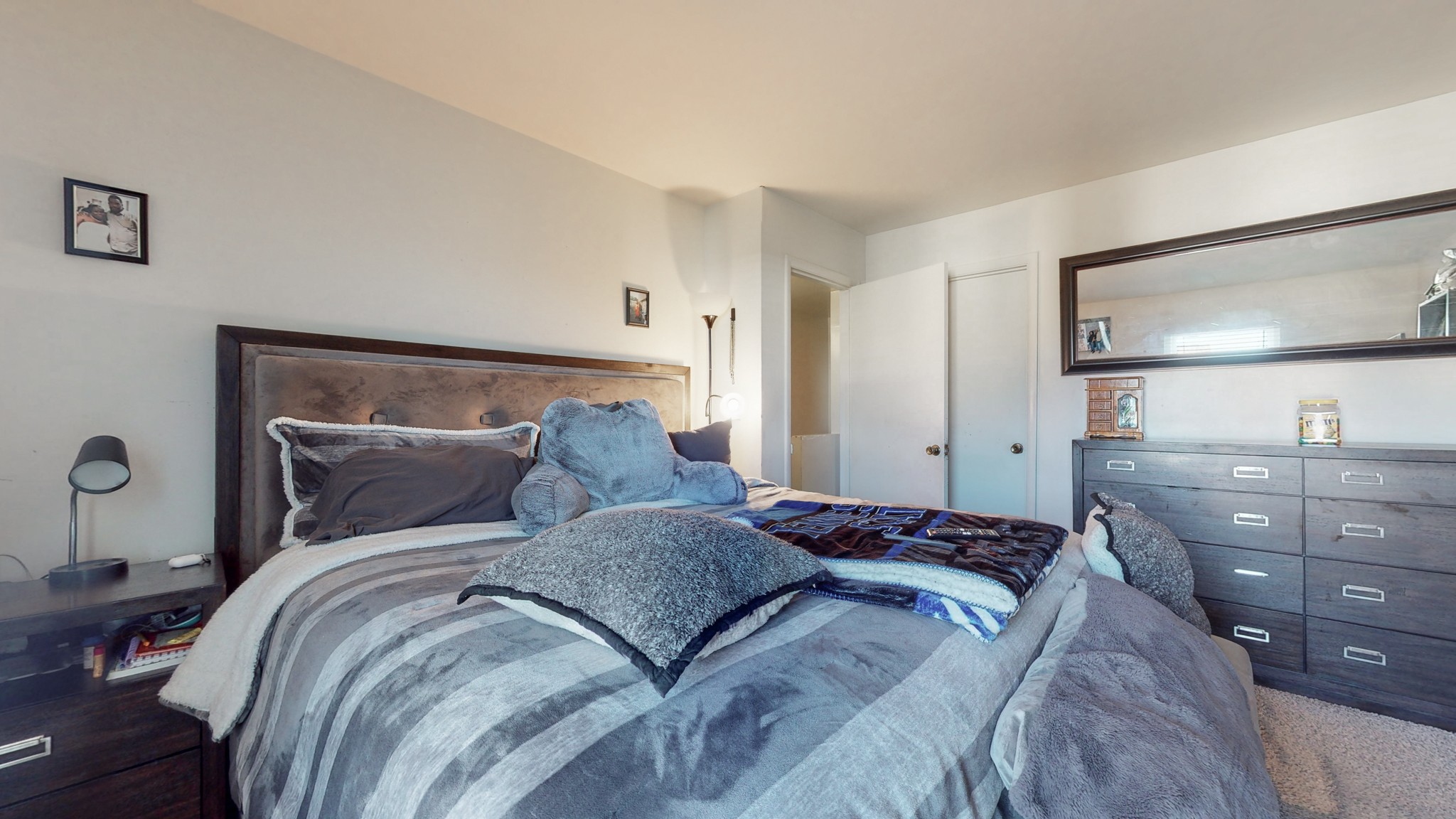 370 Wallace Road, Unit G3 Nashville, TN 37211 - Photo 21 of 30 a bedroom with a large bed and a mirror