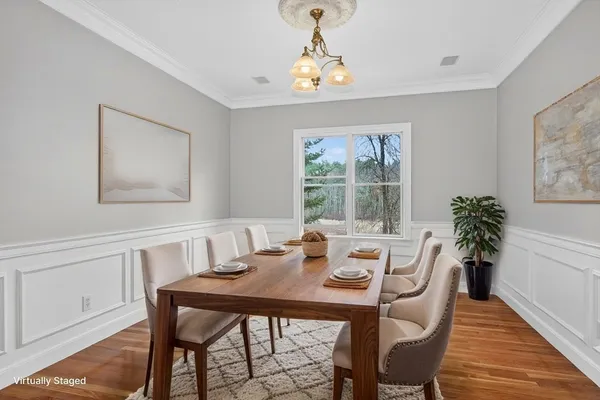 a view of a dining room with furniture window and outside view