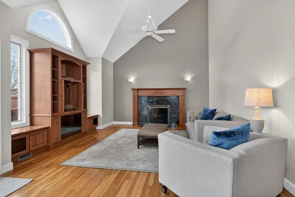a living room with furniture and a fireplace