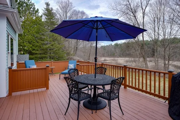 a view of balcony with outdoor seating and wooden floor