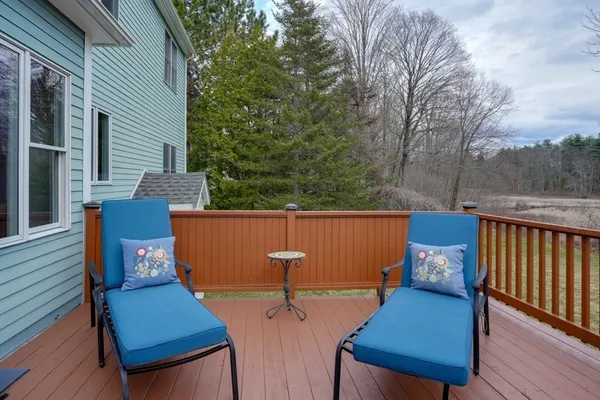 a view of a deck with furniture