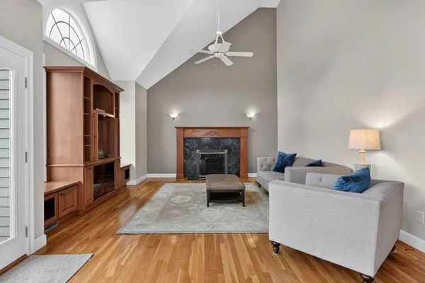 a living room with furniture and a fireplace