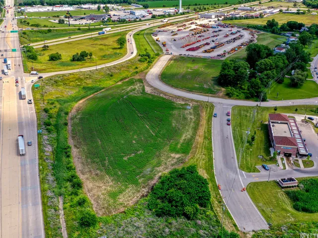 an aerial view of a house with a garden and swimming pool