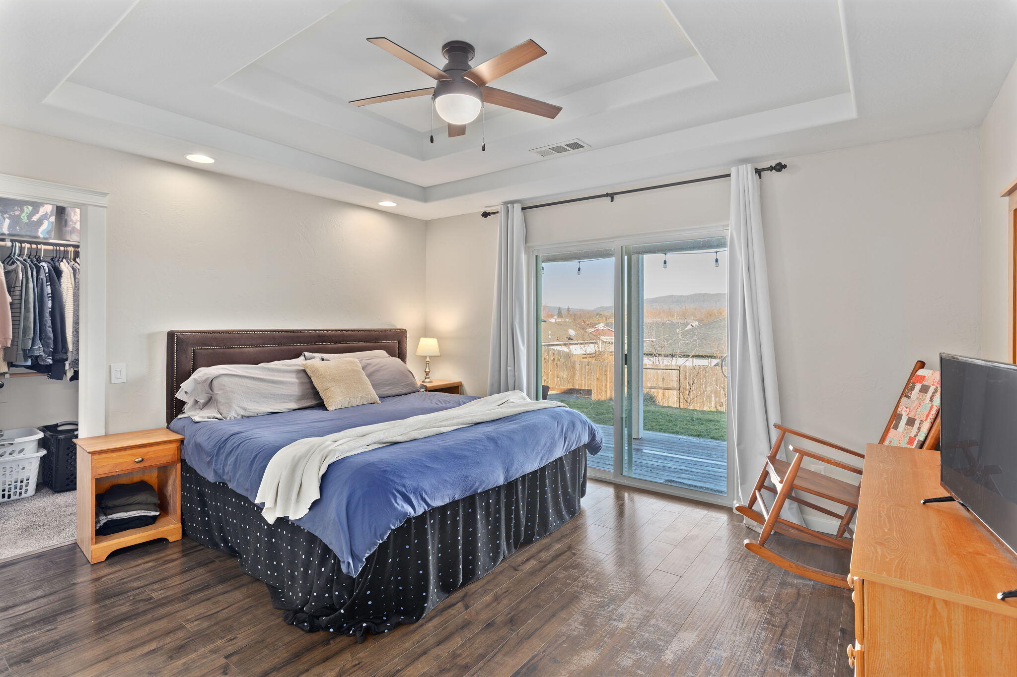 110 Linton Way Eagle Point, OR 97524 - Photo 13 of 41 a bedroom with a bed and wooden floor
