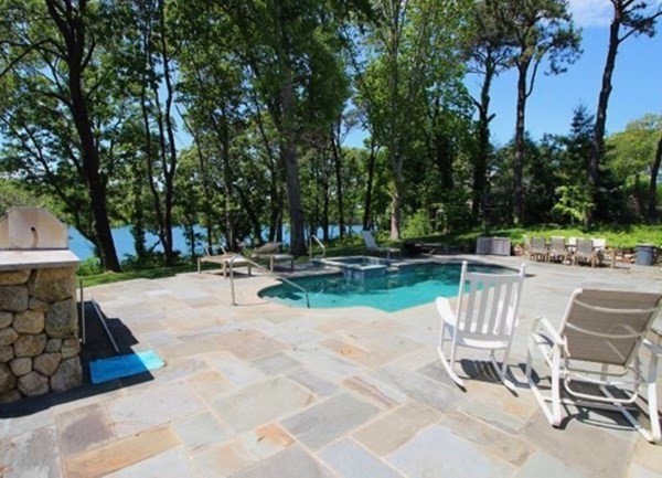 385 Barnes Road Oak Bluffs, MA 02557 - Photo 1 of 29 a view of a park with swings and slides