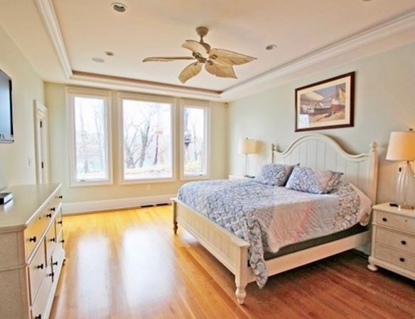 385 Barnes Road Oak Bluffs, MA 02557 - Photo 13 of 29 a bedroom with a bed and a large window