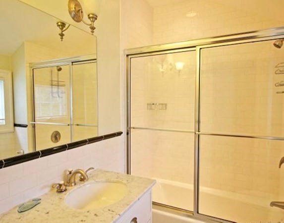 385 Barnes Road Oak Bluffs, MA 02557 - Photo 19 of 29 a bathroom with a granite countertop sink and a shower