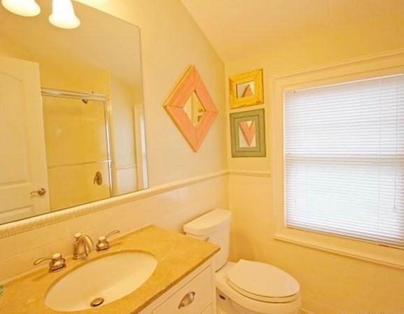 385 Barnes Road Oak Bluffs, MA 02557 - Photo 20 of 29 a bathroom with a granite countertop sink toilet and shower