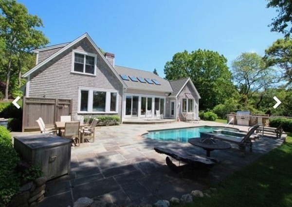 385 Barnes Road Oak Bluffs, MA 02557 - Photo 2 of 29 a view of a house with backyard and sitting area