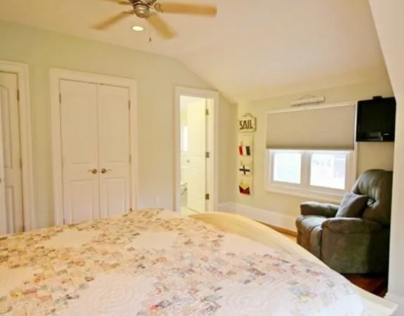 a bedroom with a bed and a couch