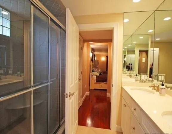 a spacious bathroom with a shower and a sink