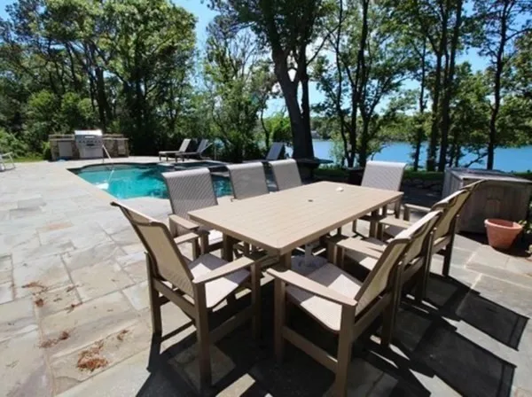 a view of a dinning table and chairs in the patio
