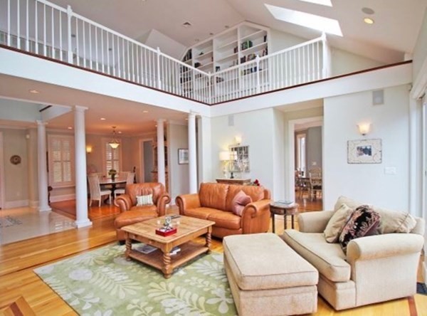 385 Barnes Road Oak Bluffs, MA 02557 - Photo 3 of 29 a living room with furniture a table and a chandelier