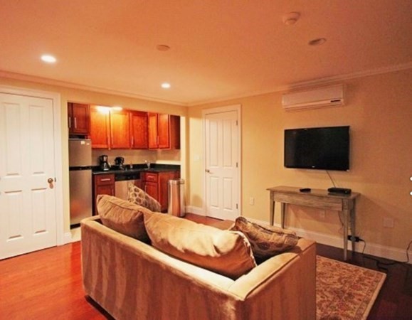 385 Barnes Road Oak Bluffs, MA 02557 - Photo 6 of 29 a living room with furniture and a flat screen tv