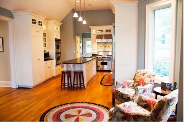 a view of a dining room with furniture and wooden floor