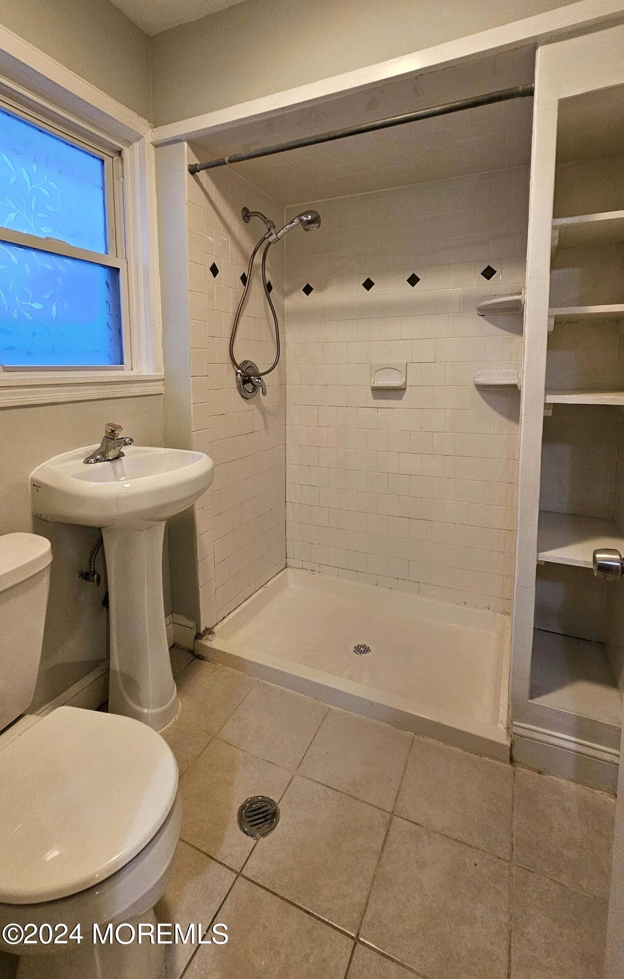 511 Bay Avenue, Unit 2 Point Pleasant Beach, NJ 08742 - Photo 4 of 13 a bathroom with a sink toilet and shower