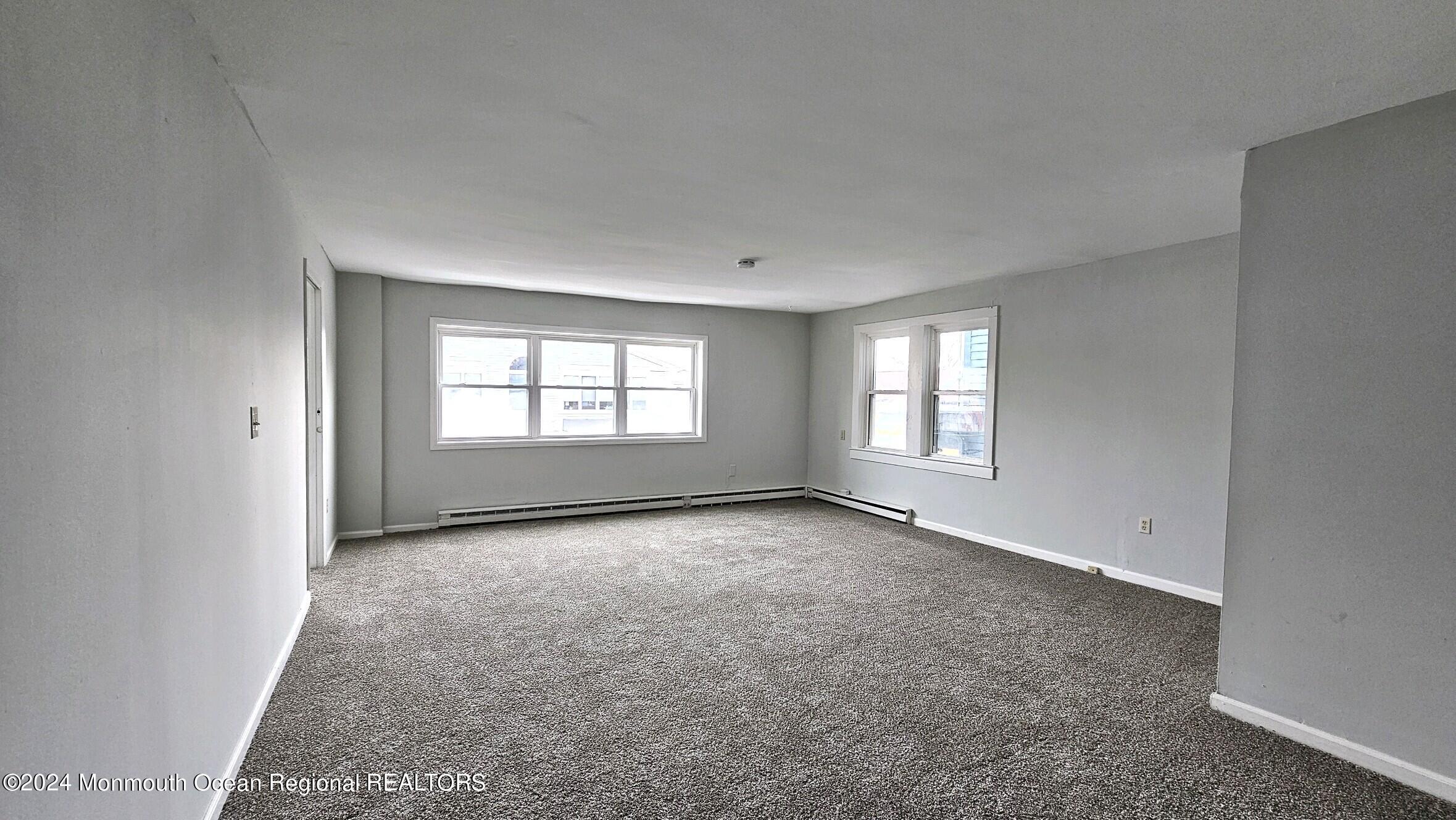 511 Bay Avenue, Unit 2 Point Pleasant Beach, NJ 08742 - Photo 7 of 13 a view of an empty room with a window
