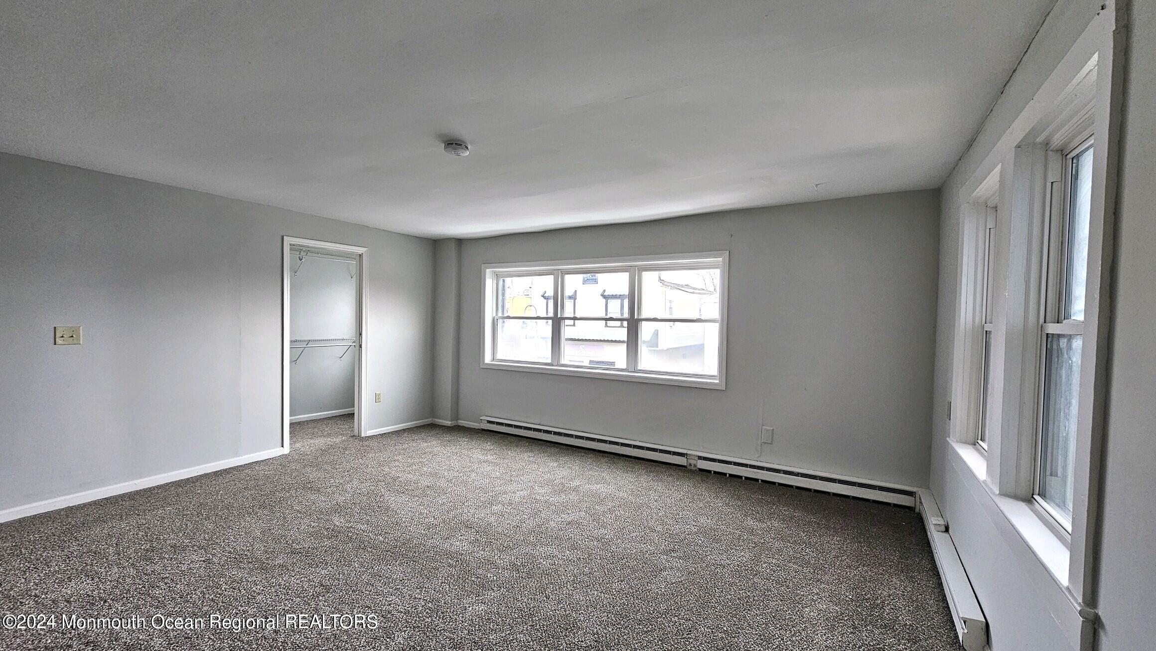 511 Bay Avenue, Unit 2 Point Pleasant Beach, NJ 08742 - Photo 8 of 13 a view of an empty room with a window