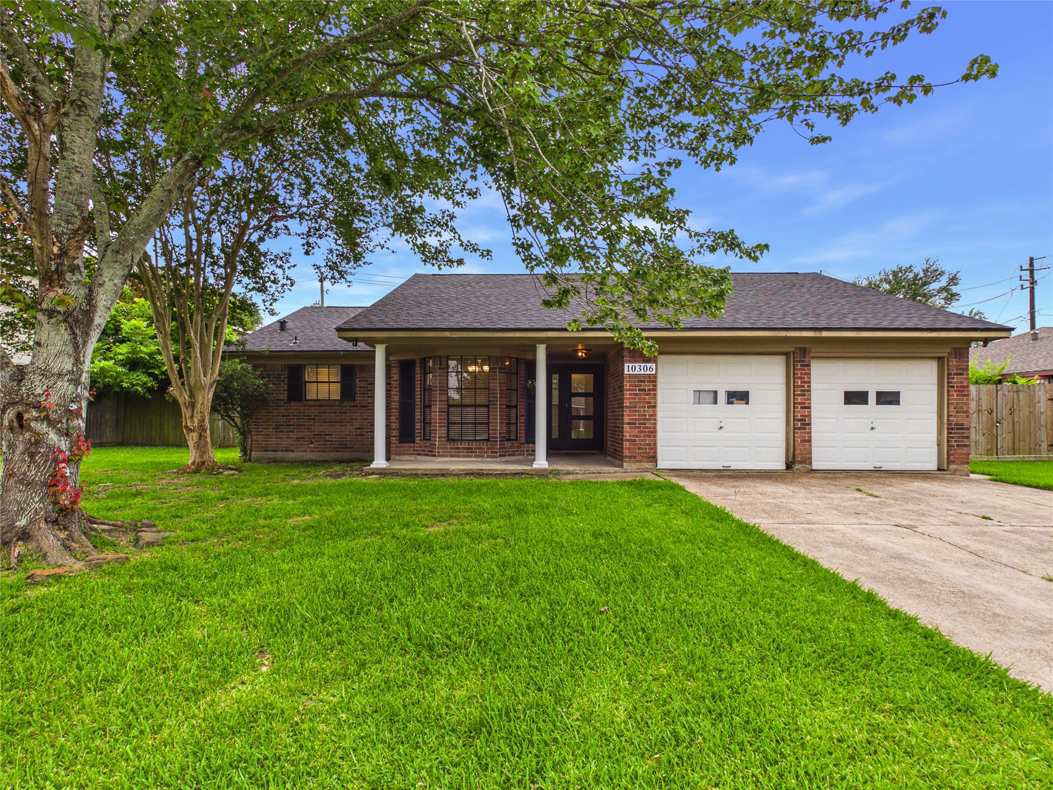 10306 Rustic Rock Road La Porte, TX 77571 - Photo 1 of 38 a front view of a house with a garden and yard