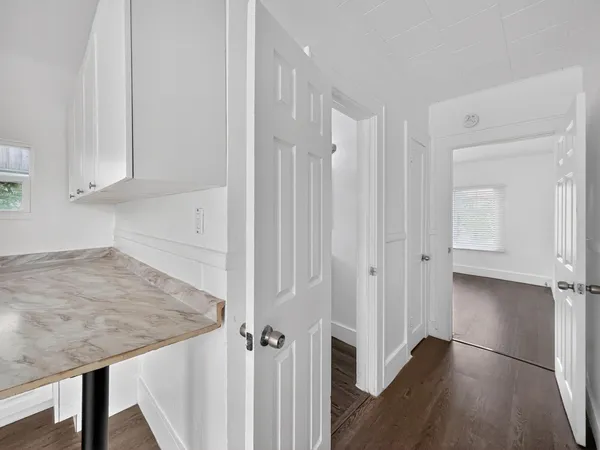 a view of a kitchen from the hallway