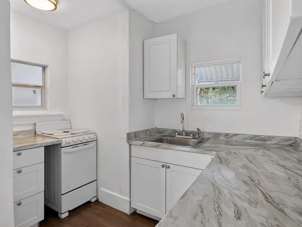 a view of cabinets with wooden floor