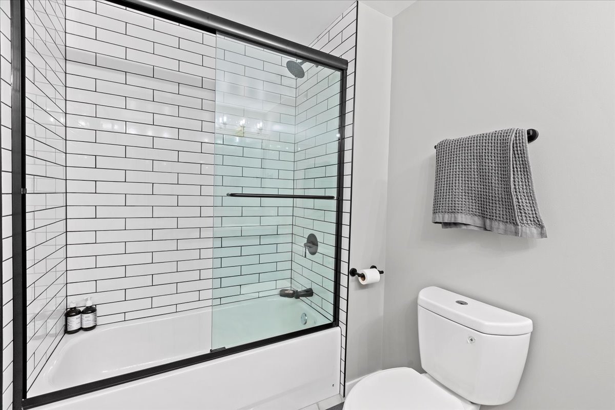 1224 West Van Buren Street, Unit 304 Chicago, IL 60607 - Photo 14 of 29 a bathroom with a shower and a toilet