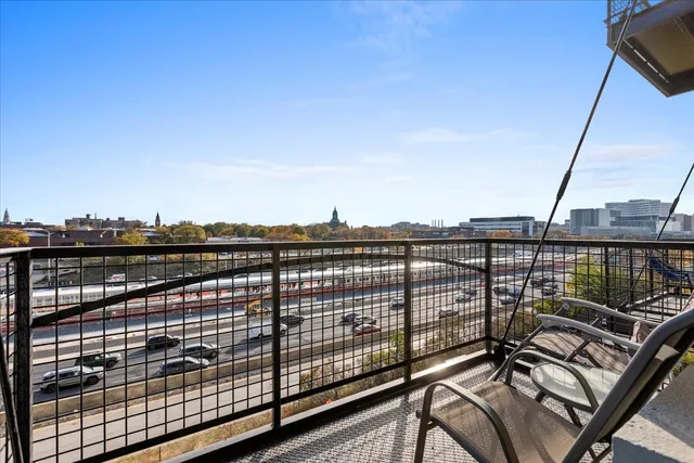 a view of a balcony with city view