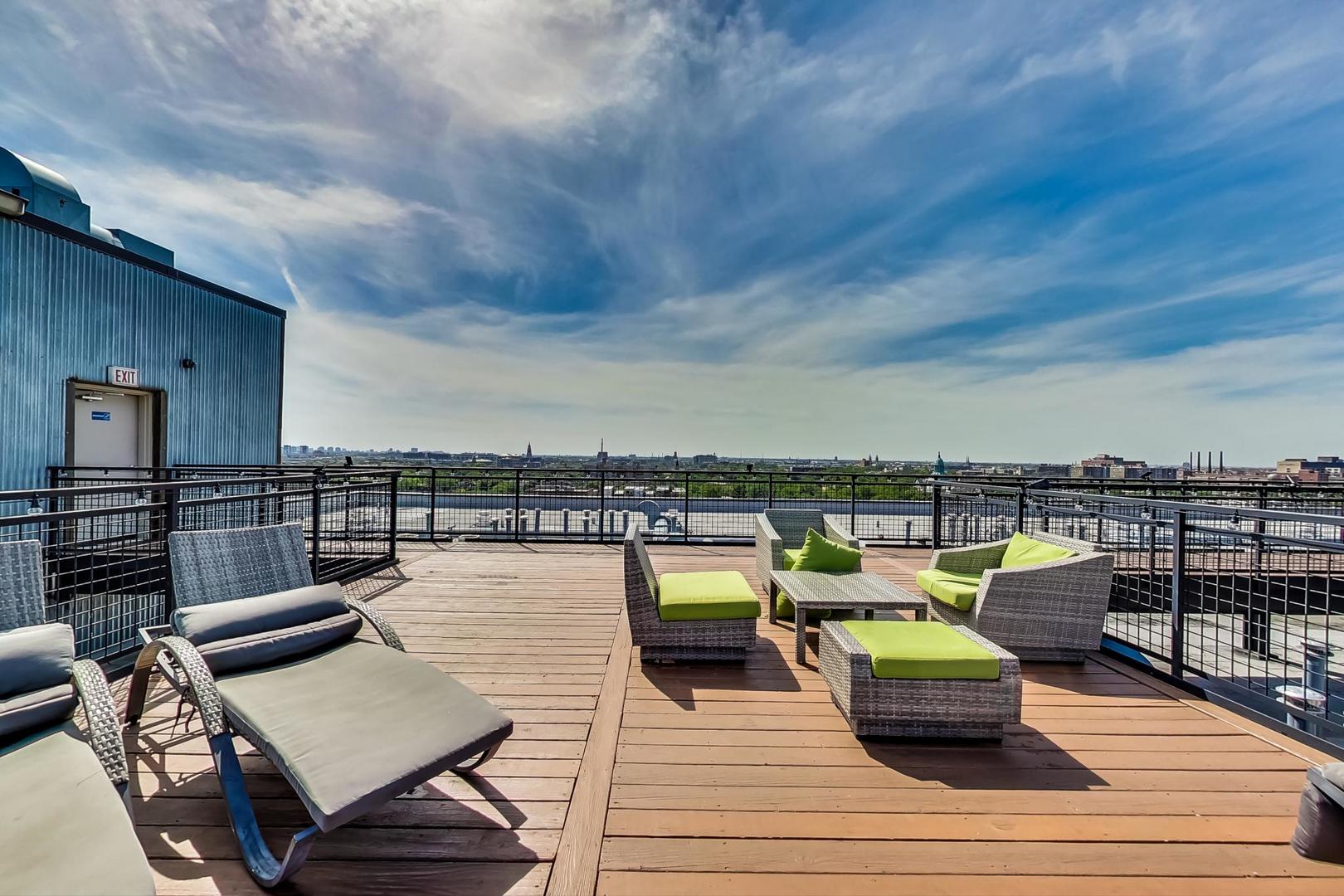 1224 West Van Buren Street, Unit 304 Chicago, IL 60607 - Photo 22 of 29 a view of a terrace with seating area