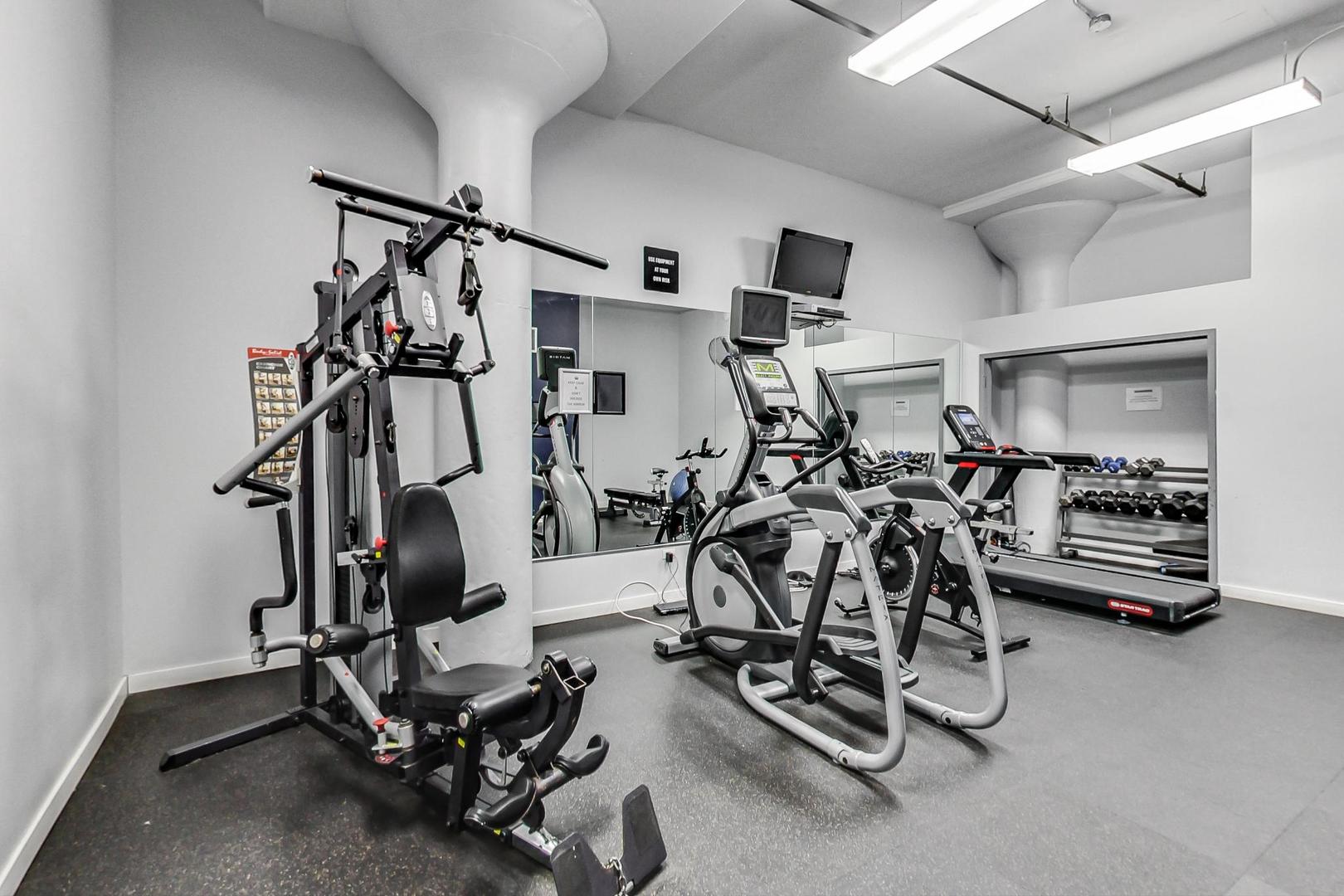 1224 West Van Buren Street, Unit 304 Chicago, IL 60607 - Photo 23 of 29 a view of a room with gym equipment