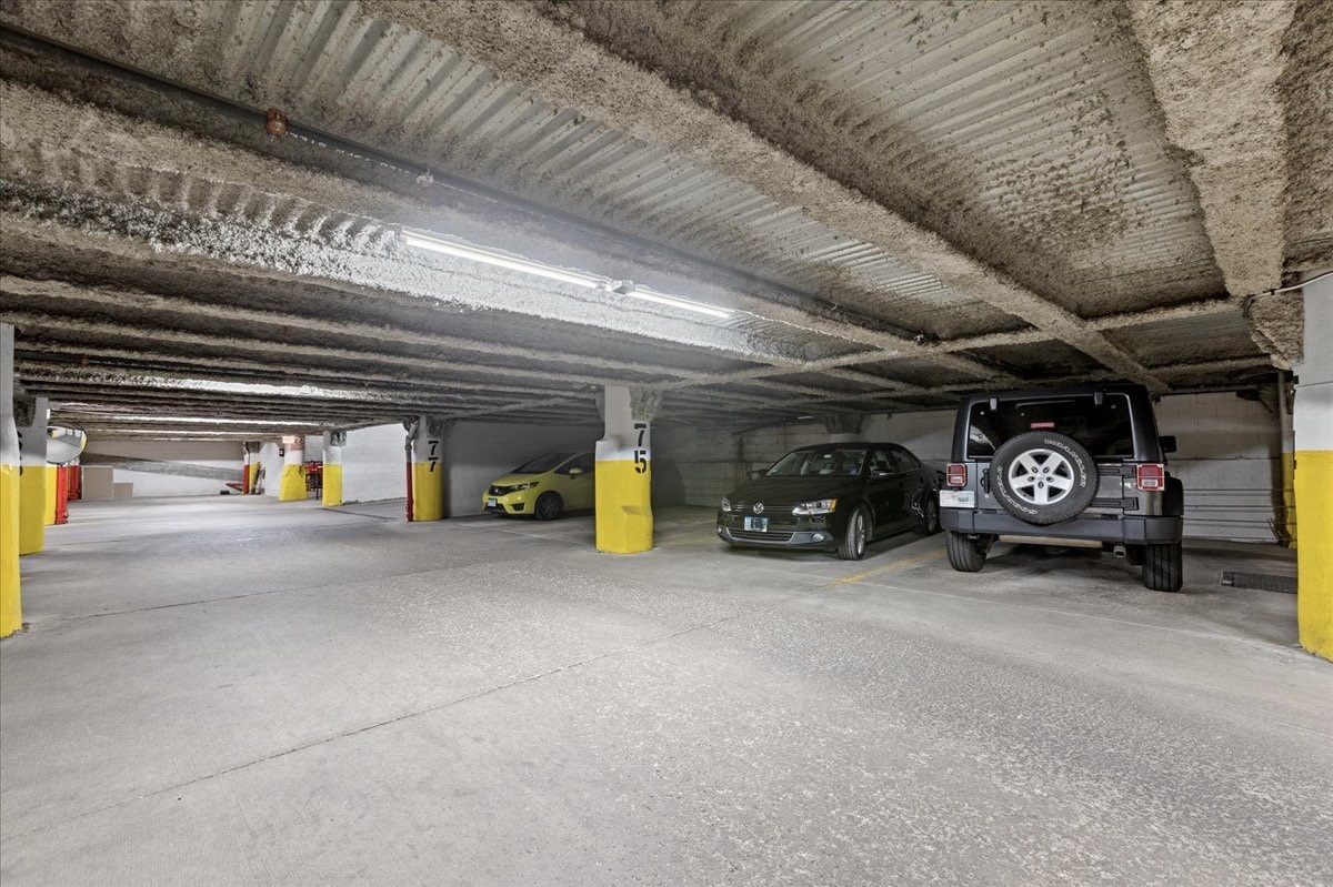 1224 West Van Buren Street, Unit 304 Chicago, IL 60607 - Photo 28 of 29 a view of parking garage with cars