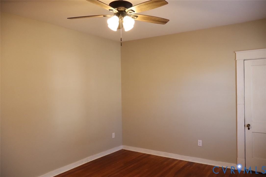 9540 Pridesville Road Amelia Court House, VA 23002 - Photo 11 of 15 wooden floor in a empty room