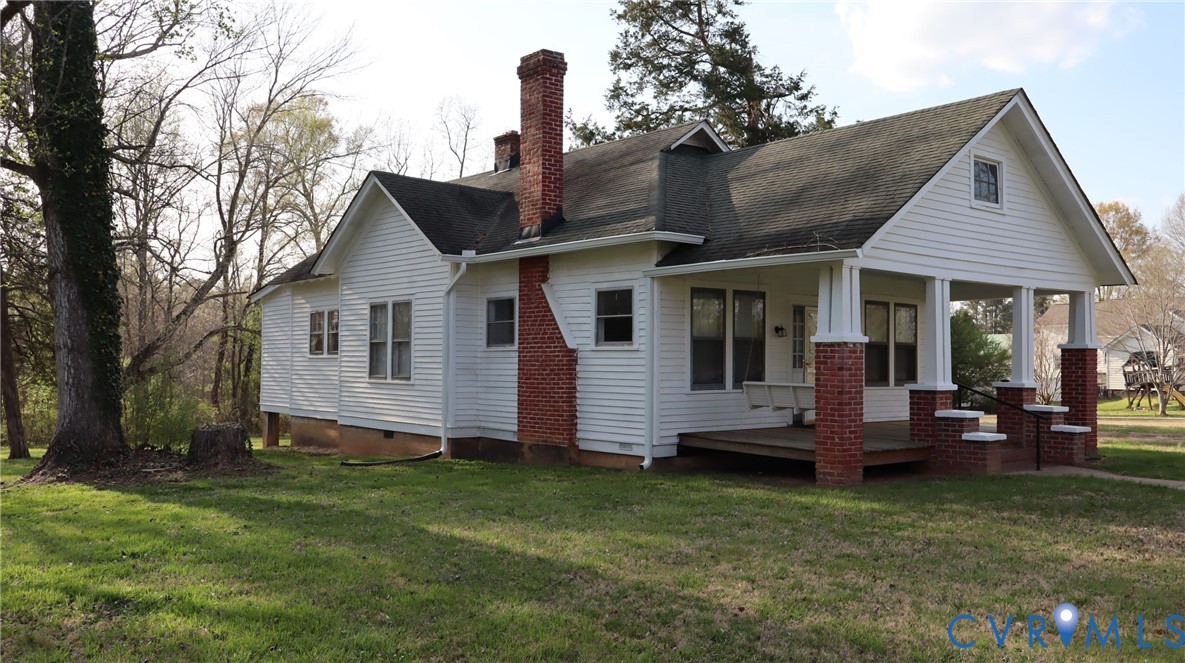 9540 Pridesville Road Amelia Court House, VA 23002 - Photo 2 of 15 a front view of a house with a garden