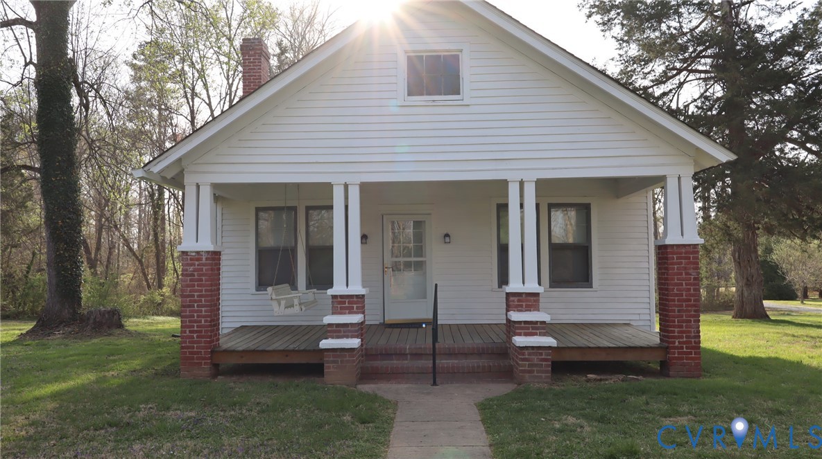 9540 Pridesville Road Amelia Court House, VA 23002 - Photo 3 of 15 a view of a small house with a yard