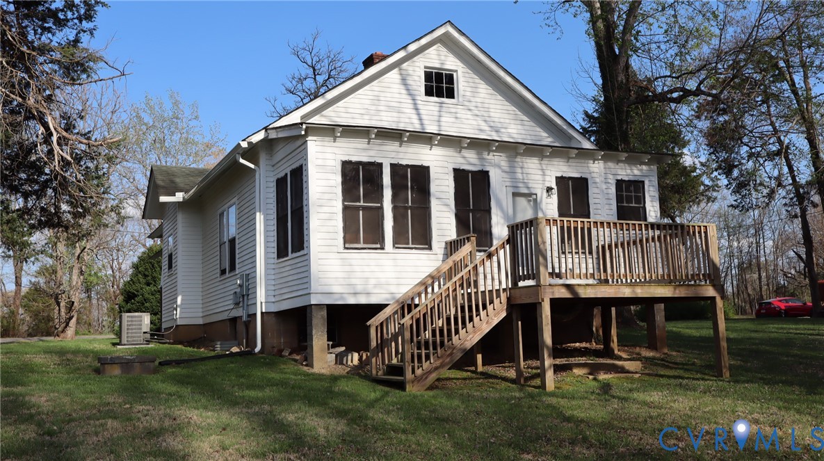 9540 Pridesville Road Amelia Court House, VA 23002 - Photo 4 of 15 a view of a house with a yard and deck
