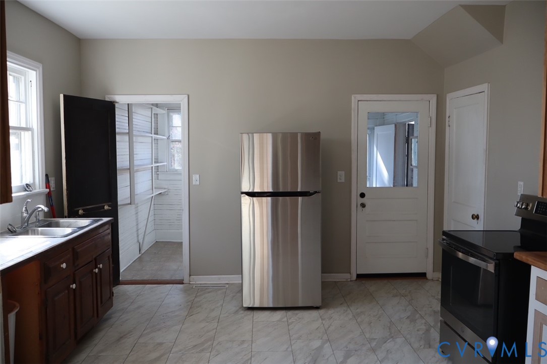 9540 Pridesville Road Amelia Court House, VA 23002 - Photo 5 of 15 a kitchen with stainless steel appliances granite countertop a refrigerator and a stove top oven