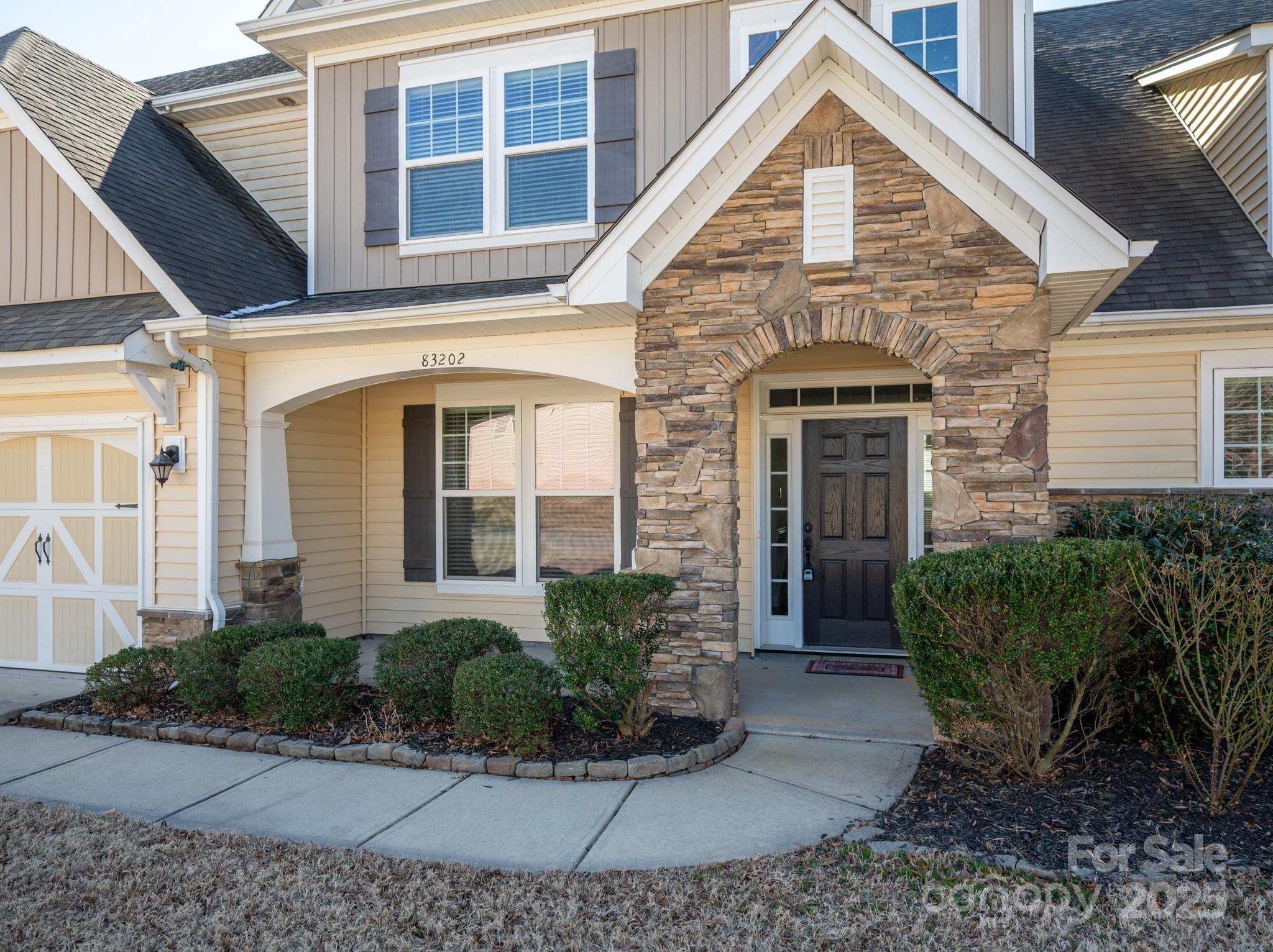 83202 Cortland Drive Lancaster, SC 29720 - Photo 3 of 47 a view of a brick house with many windows