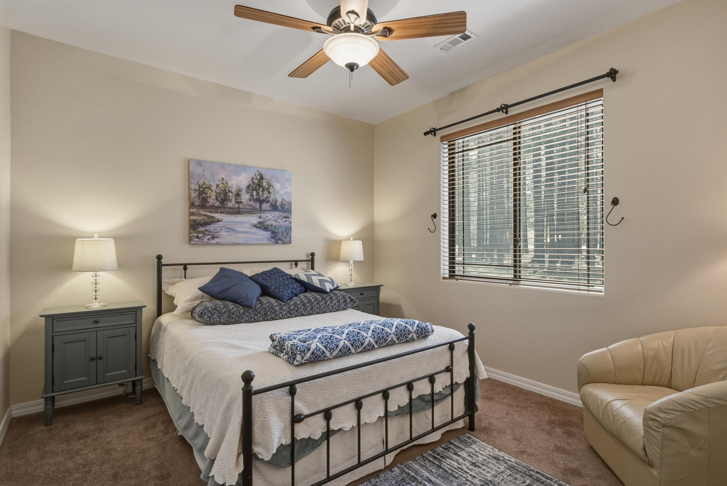 1233 Merzville Road Forest Lakes, AZ 85931 - Photo 23 of 39 a bedroom with a bed and a couch