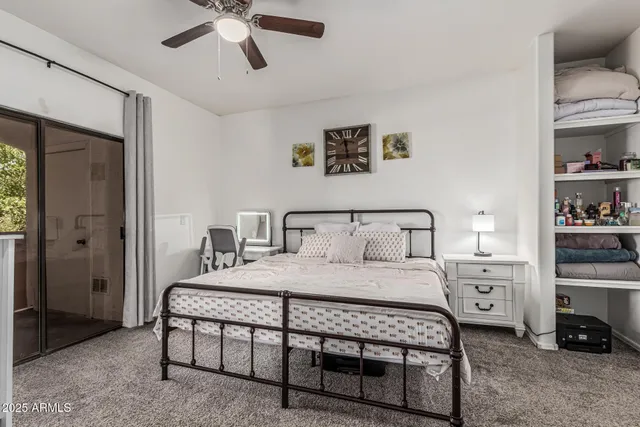 a bedroom with a bed and a cabinets