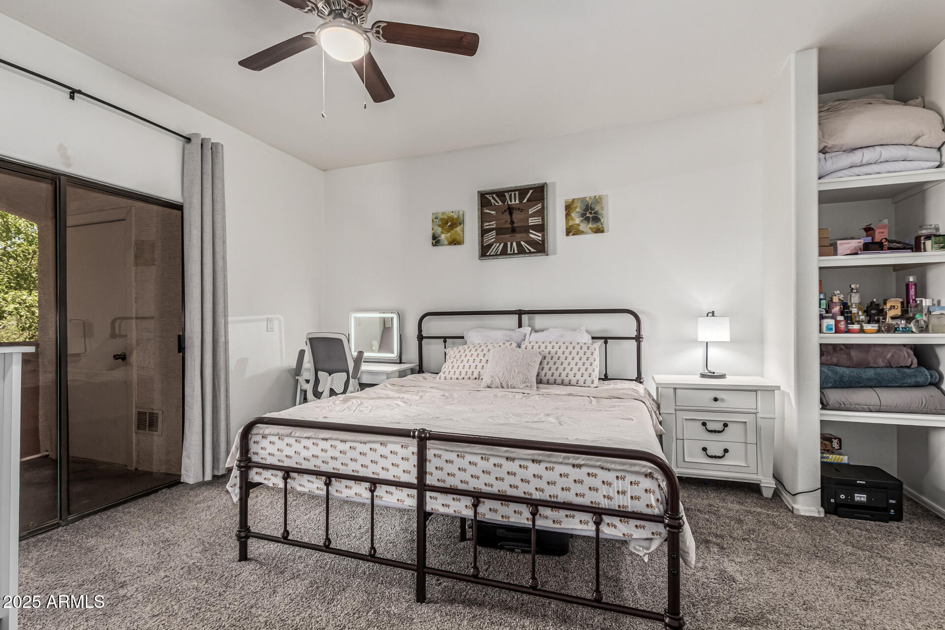 10030 West Indian School Road, Unit 255 Phoenix, AZ 85037 - Photo 12 of 26 a bedroom with a bed and a cabinets