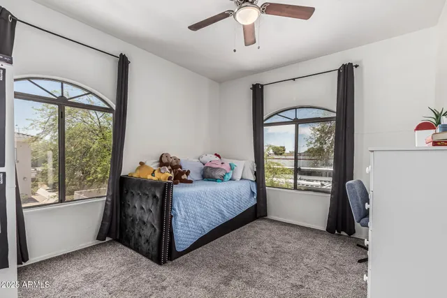 a bed room with a bed and a window