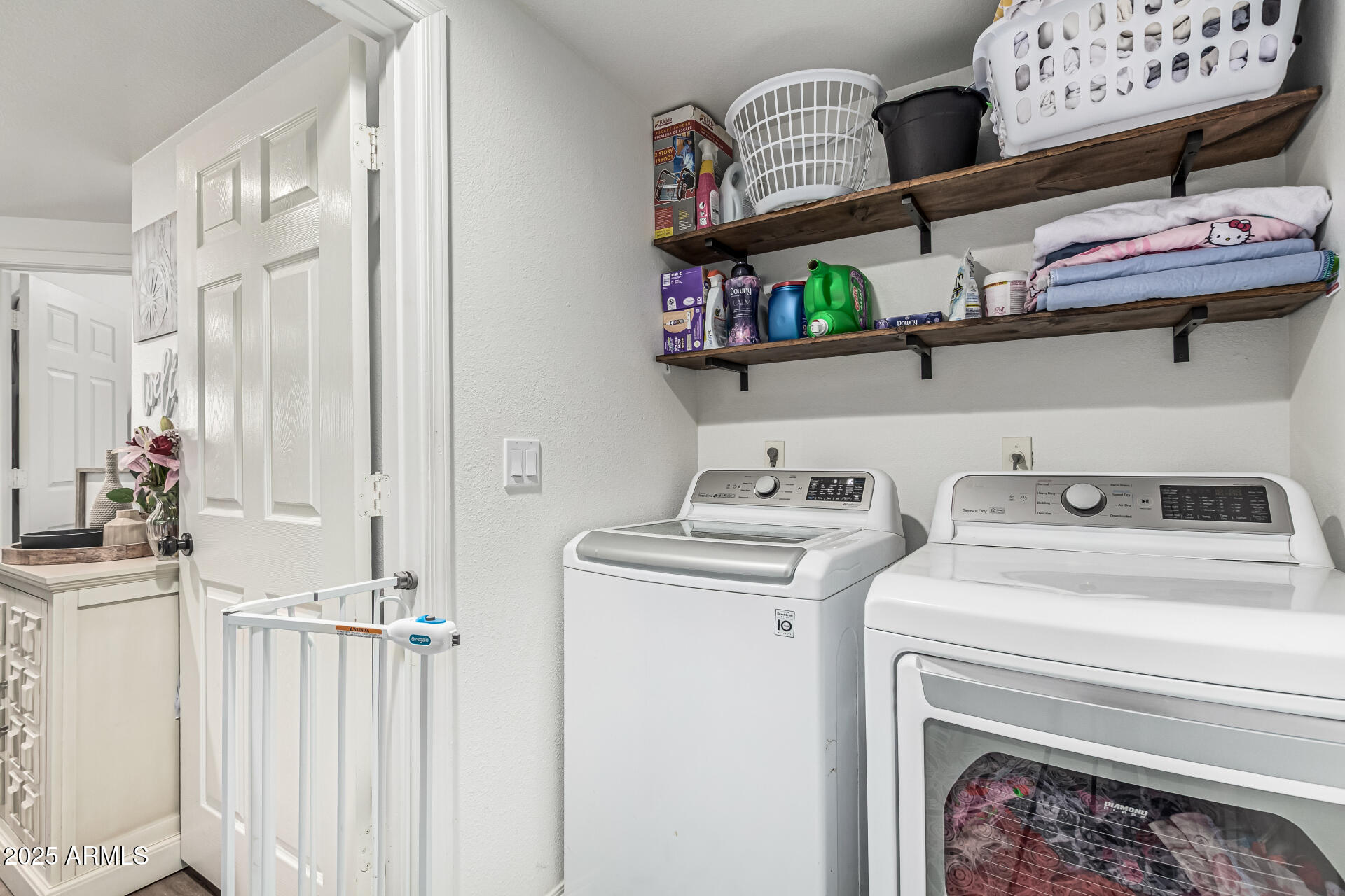 10030 West Indian School Road, Unit 255 Phoenix, AZ 85037 - Photo 18 of 26 a utility room with dryer and washer