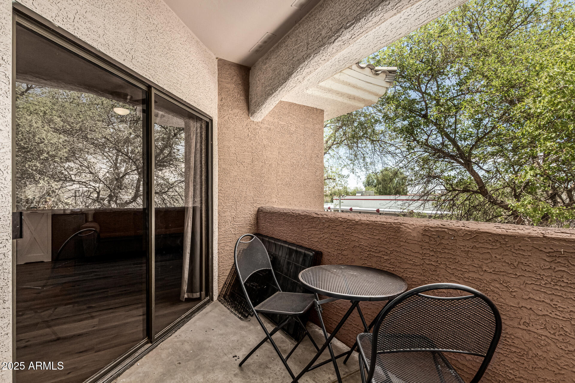 10030 West Indian School Road, Unit 255 Phoenix, AZ 85037 - Photo 19 of 26 a view of balcony and patio