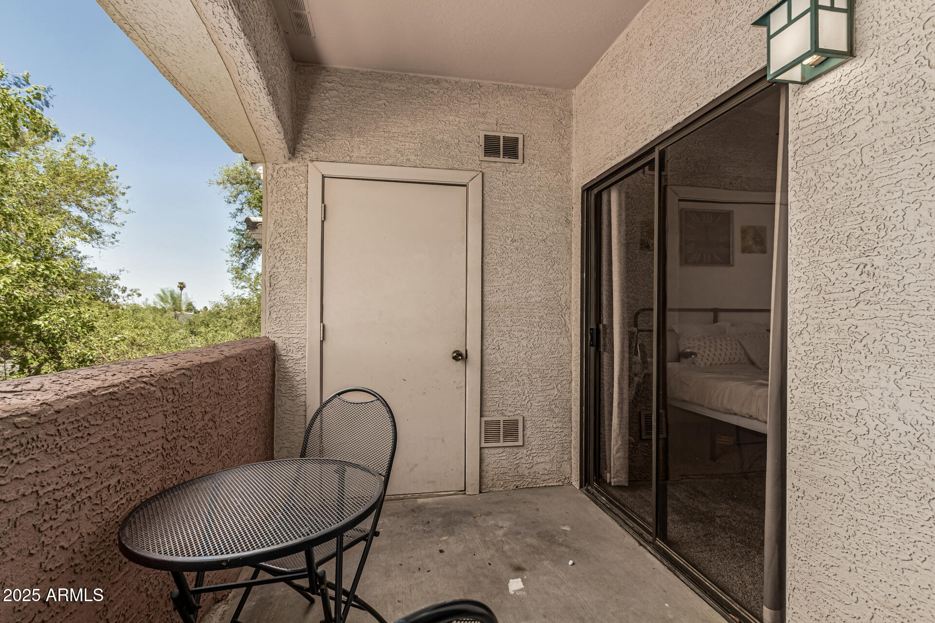 10030 West Indian School Road, Unit 255 Phoenix, AZ 85037 - Photo 20 of 26 a backyard of a house with table and chairs