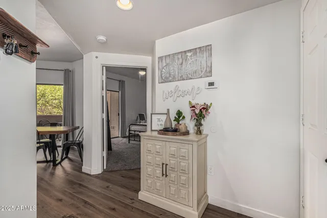 a dining room with furniture and wooden floor