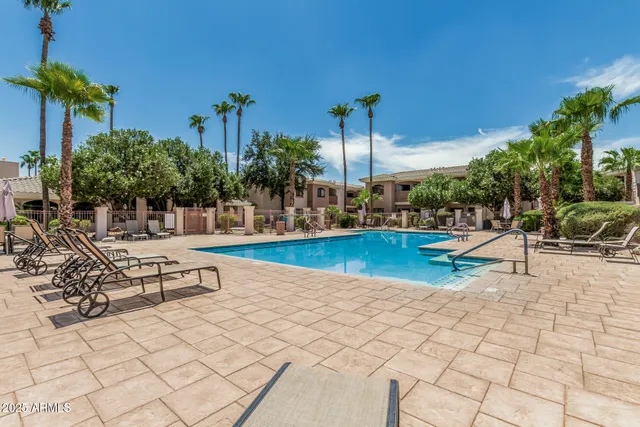 a view of swimming pool with outdoor seating
