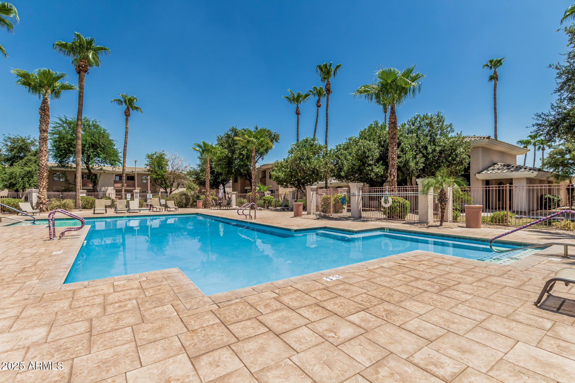 10030 West Indian School Road, Unit 255 Phoenix, AZ 85037 - Photo 22 of 26 a view of swimming pool with outdoor seating